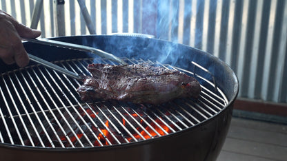 Steak grilling over glowing BAM bamboo charcoal
